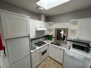 Kuchyň nebo kuchyňský kout v ubytování Gogartys Temple Bar Apartments