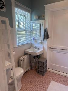 a bathroom with a sink and a toilet and a ladder at The Manor at Glen Jean Meadows in Oak Hill +59 photos