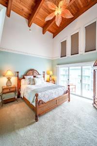 a bedroom with a large bed and a ceiling fan at Luxury Penthouse Apartment with Private Elevator in Ocean City