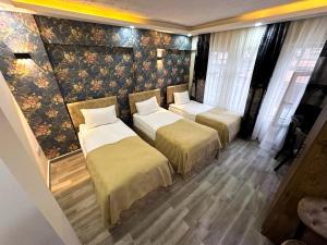 Säng eller sängar i ett rum på Marmara Sahil Otel