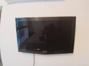 a flat screen tv sitting on a wall at Smart Studio 503 in Santa Cruz de la Sierra