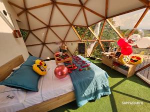 Voodi või voodid majutusasutuse Elementium Glamping toas