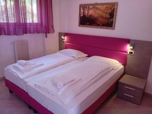 Postel nebo postele na pokoji v ubytování Andreis Apartments