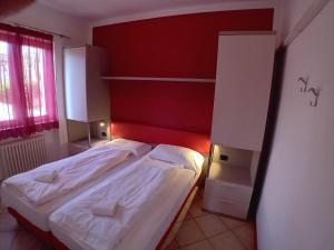 Postel nebo postele na pokoji v ubytování Andreis Apartments