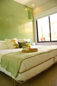 Cama o camas de una habitación en Hotel Amavi