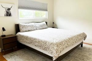 a bedroom with a bed and a window at Large house and yard close to La Jolla, UCSD, UTC Mall! in San Diego