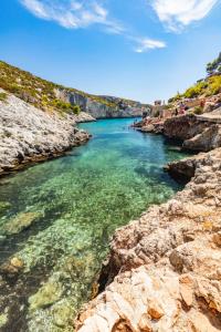 a view of a river with rocks and water at Villa Roxa Montuoso in Agios Leon