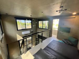 an overhead view of a living room with a counter and windows at Patar Palms in Bolinao