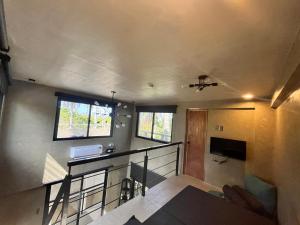 a view of a room with a staircase and a balcony at Patar Palms in Bolinao +26 photos