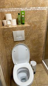 a bathroom with a white toilet in a stall at Chic Urban Retreat 2 in London