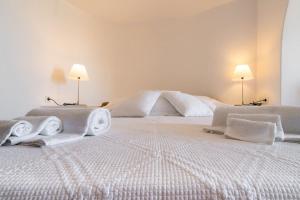 Voodi või voodid majutusasutuse The SaltWater Pool Villa - Mykonos toas