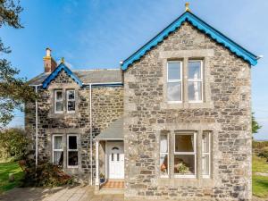 an old stone house with a blue roof at 4 Bed in St Keverne TVALL in Saint Keverne
