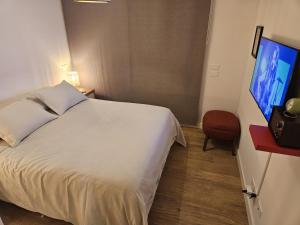 En eller flere senge i et værelse på JOY MONTEVIDEO - Apartamento Premium - Servicios de Hotel 5 Estrellas