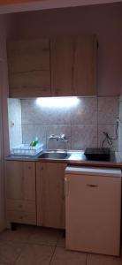 a kitchen with a sink and a counter top at Sunrise2 in Paralia Katerinis