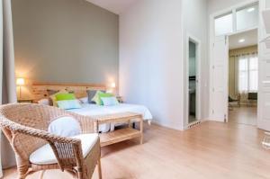Triana 103 Rooms & Suites客房内的一张或多张床位