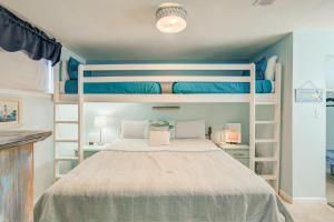 a bedroom with two bunk beds in it at Sugar Beach 301 by Vacation Homes Collection in Gulf Shores
