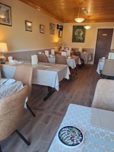 a restaurant with tables and chairs in a room at Mountain View Guesthouse in Oughterard