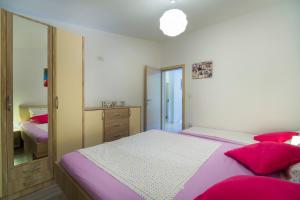 Posteľ alebo postele v izbe v ubytovaní Apartment Masuni