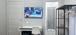 TV a/nebo společenská místnost v ubytování Porta Mazzini Central Rooms + 32 fotografií