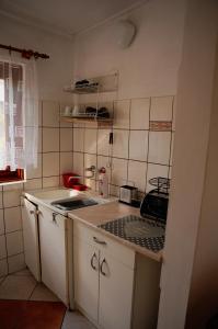 a kitchen with a sink and a counter top at Gospodarstwo Agroturystyczne Kłączno in Kłaczno +35 photos