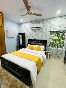 Ένα ή περισσότερα κρεβάτια σε δωμάτιο στο Tiram Villa