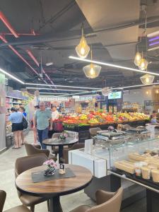 a group of people standing in a grocery store at Jumeirah Beach Residence in Dubai