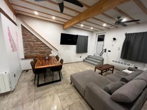 a living room with a couch and a table at C&A Apartments in Kaiserslautern