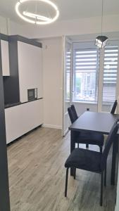 an office with a table and chairs and a tv at AIRHOTEL in Codru +27 photos
