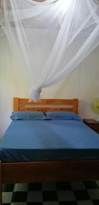 מיטה או מיטות בחדר ב-Casa de Andréa