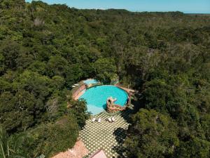 an overhead view of a swimming pool in a forest at Santuário Hotel Fazenda in Santo André