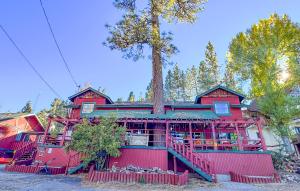 a red house with a tree on top of it at ITH Big Bear Lake Hostel & Lodge in Big Bear Lake