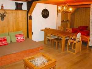 a living room with a table and a dining room at Holiday apartment Siegsdorf in Bavaria in Siegsdorf