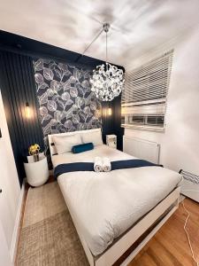 Cama o camas de una habitación en Paddington 3-Bedroom, 2-Bathroom Apartment In Central London