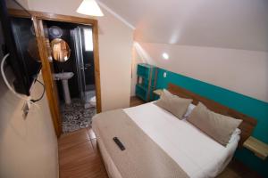 Cama ou camas em um quarto em Hostal Terraza Recreo