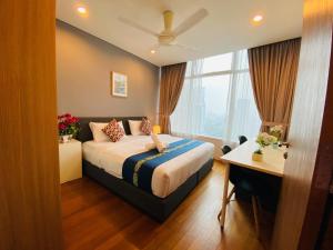 Postel nebo postele na pokoji v ubytování KLCC Vortex Apartment Suites kula Lumpur + 81 fotografií