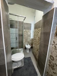 a bathroom with a toilet and a shower at Civico 10 II in Sassari