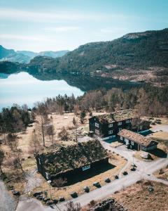 an aerial view of a building next to a lake at Preikestolen BaseCamp in Jørpeland