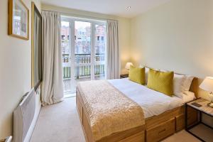 a bedroom with a bed and a large window at Host & Stay - Waterside in Durham