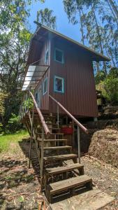 a house with stairs leading up to it at La Esperanza Lodge and Reserve in Jardin