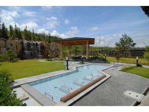 a swimming pool with a pavilion in a garden at KAISYU - Vacation STAY 42706v in Kyotango