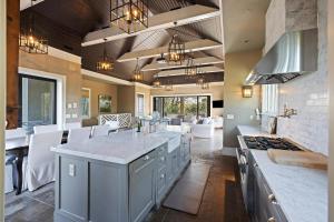 a kitchen with a large island with a counter top at 9 2nd Avenue in Isle of Palms