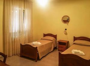 A bed or beds in a room at Villa Fiorita