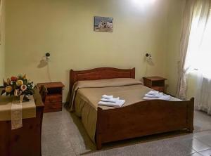 A bed or beds in a room at Villa Fiorita Még 21 kép