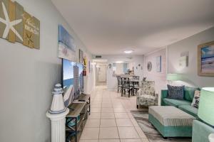 a living room with a couch and a table at Gulf Tower 3C by Vacation Homes Collection in Gulf Shores