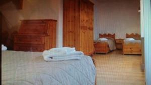 Postel nebo postele na pokoji v ubytování Hotel Lares