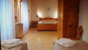 Postel nebo postele na pokoji v ubytování Hotel Lares