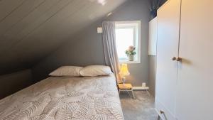 Postel nebo postele na pokoji v ubytování Villa Unstad - Surf Beach Lofoten + 36 fotografií