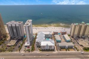 an aerial view of a beach and buildings and the ocean at Sea Glass 316 by Vacation Homes Collection in Gulf Shores