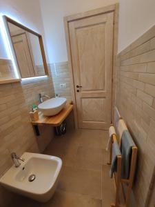a bathroom with a sink and a mirror at Villa Jana in Porto Pollo