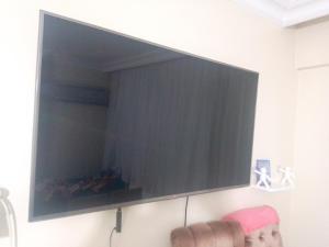 a large flat screen tv hanging on a wall at Miracle HYLen Hotel in Istanbul